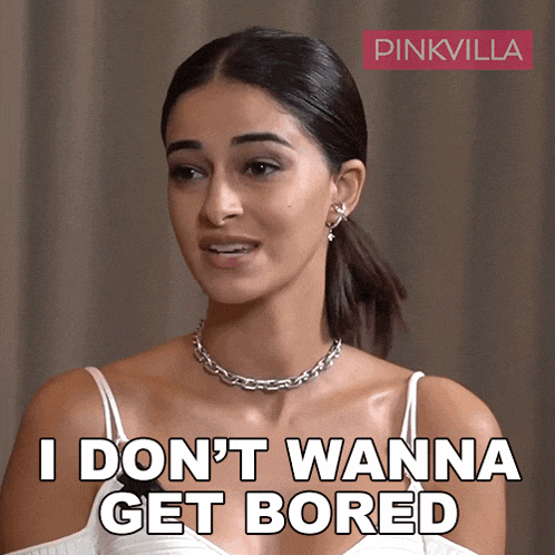 a woman wearing a necklace and earrings says i don t wanna get bored