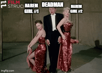 a man in a tuxedo is standing next to two women in red dresses