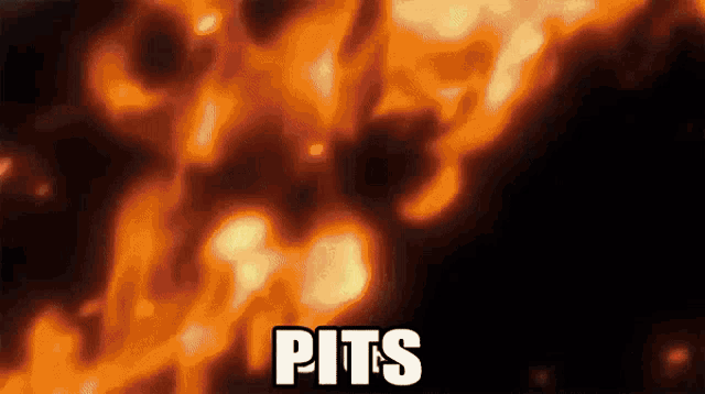 a close up of a fire with the word pits on it