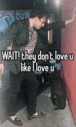 a man leaning against a wall with the words wait they don 't love u like i love u on the bottom