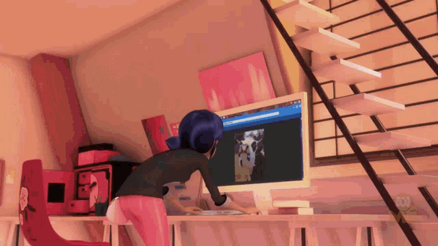 a girl with blue hair is looking at a computer monitor