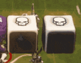 two dice with skulls on them are sitting on a table .