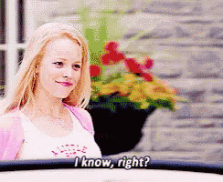 a woman says i know right in front of a brick wall