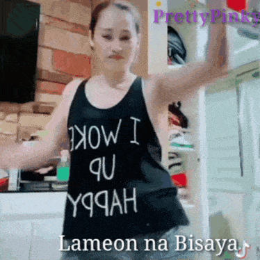 a woman wearing a black tank top that says " how i qu y9jah "