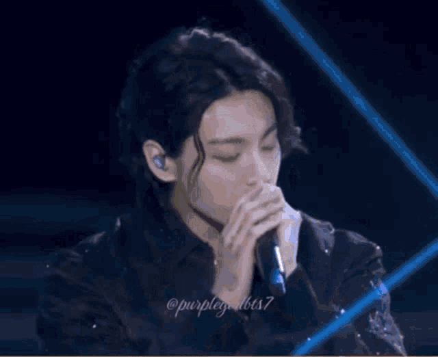 a close up of a person 's face with the name purplegirlbts7 on the bottom right