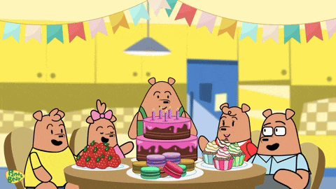 a cartoon of four bears sitting around a table with a birthday cake