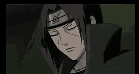a close up of itachi uchiha from naruto wearing a headband and looking down .