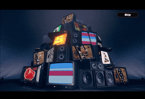 a bunch of televisions and speakers are stacked on top of each other with the word skip in the corner