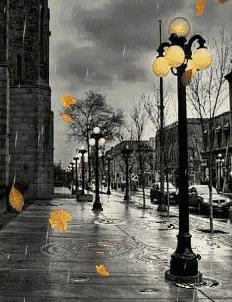 a black and white photo of a street with a street light