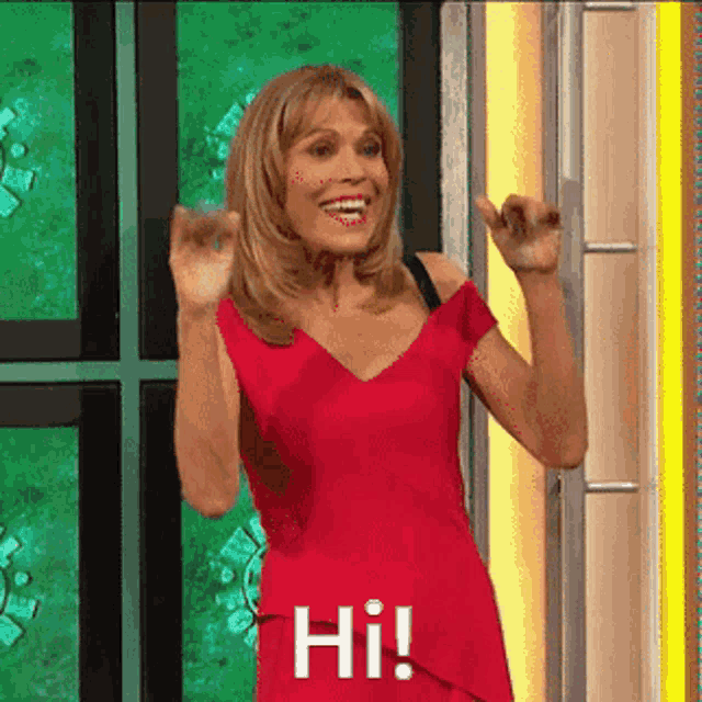 a woman in a red dress says hi on a screen