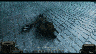 a video game screen shows a man laying on the floor and says press f to start