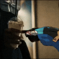 a person in a blue jacket is holding a plastic cup
