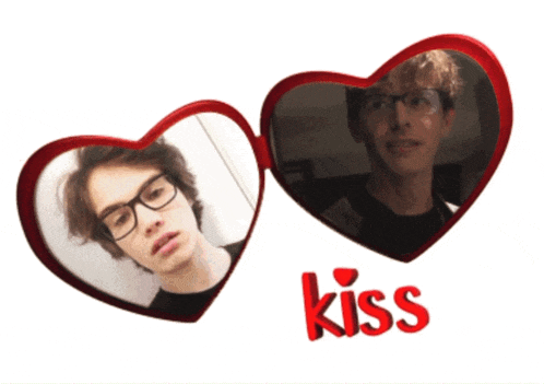 two heart shaped mirrors with the word kiss on the bottom right