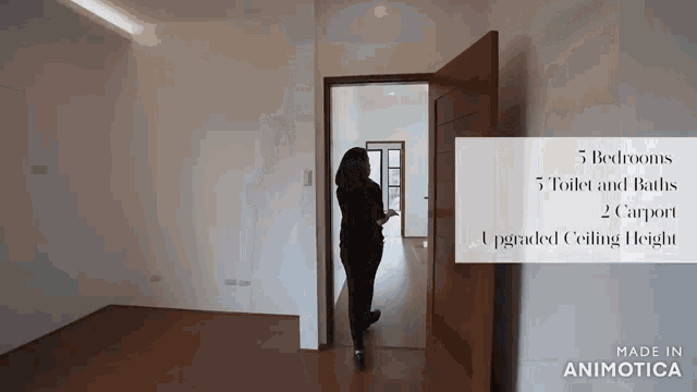 a woman is standing in an empty room with the words 5 bedrooms 5 toilet and baths 2 carport upgraded ceiling height on the bottom