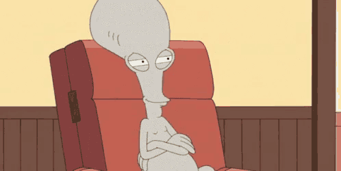 a cartoon character is sitting in a red chair