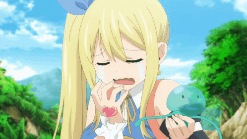 a girl with blonde hair is crying while holding a green frog