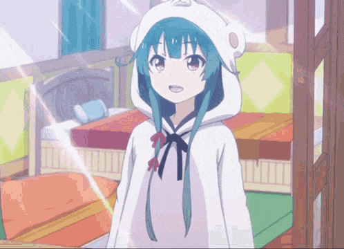 a girl with blue hair and a white hoodie is standing in a room .