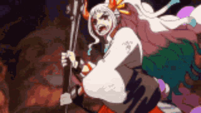 a woman in a kimono is holding a sword in her hand .
