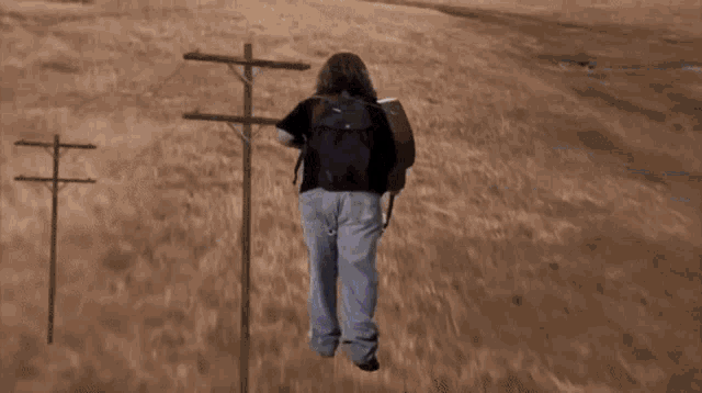 a person is running past a speed limit sign that reads 55