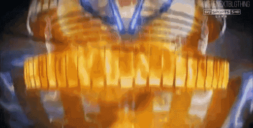 a blurred image of a person 's chest with the words sky sports live visible