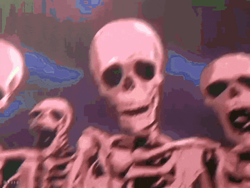 a group of pink skeletons with green eyes are dancing