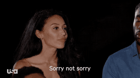 a woman says " sorry not sorry " in front of a group of people