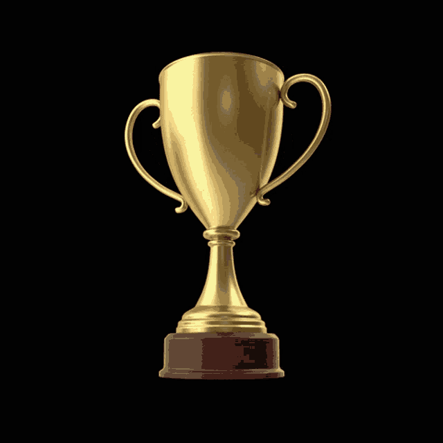 a gold trophy on a black background with a red base