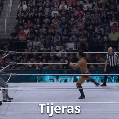 a man in a wrestling ring with the word tijeras written on it