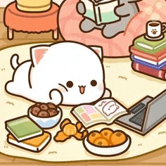 a cartoon cat is laying on a rug next to a laptop .