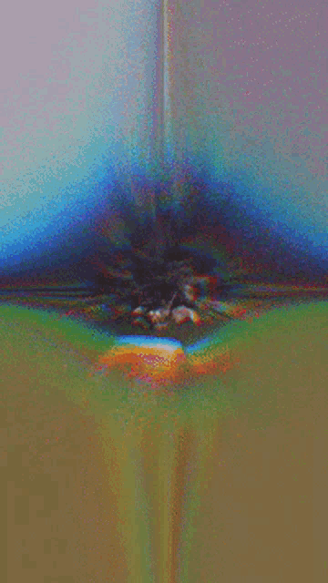 a blurry picture of a person 's face with a colorful background