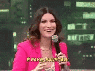 a woman in a pink jacket is holding a microphone and says e fake faustao .