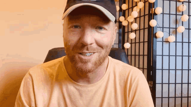 a man with a beard wearing a hat that says ' a ' on it