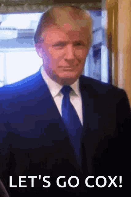 a man in a suit and tie says let 's go cox .