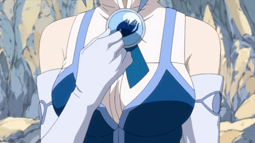 a woman in a blue and white dress is holding a pendant on her chest