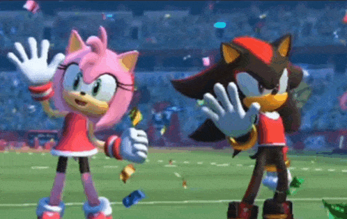 amy and shadow from sonic the hedgehog are dancing on a soccer field .