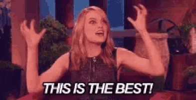 a woman is holding her arms in the air and says this is the best .