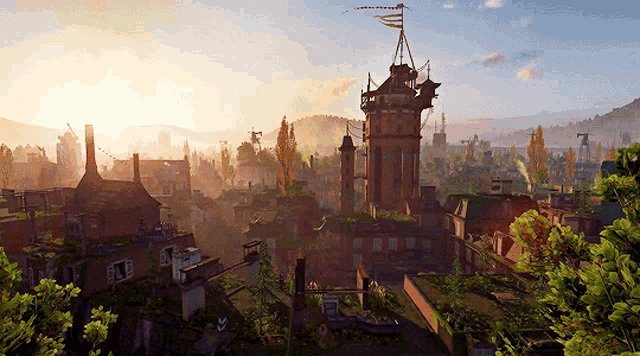an aerial view of a city with a tower in the middle