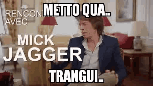 mick jagger is sitting in a chair in a living room with a caption that says `` mick jagger tranquil '' .