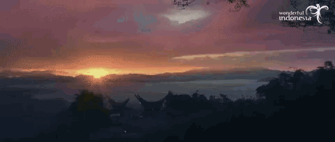 a picture of a sunset with wonderful indonesia written on the bottom