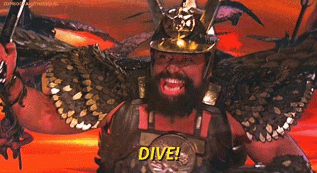a man with a beard is wearing a helmet and holding a belt that says dive on it
