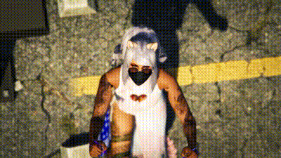 a man in a white dress and mask is standing on a street .