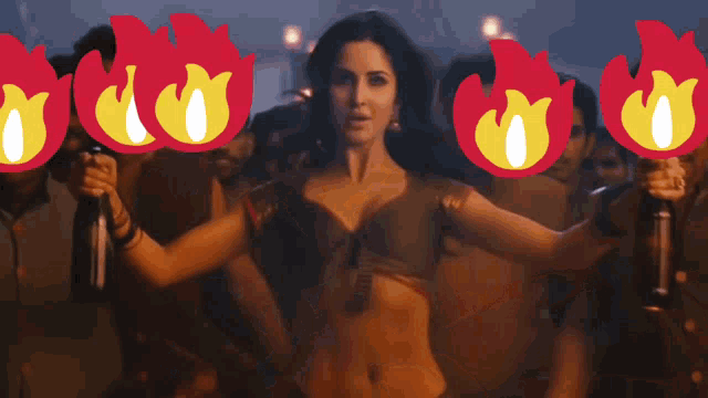 a woman is dancing in front of a group of men with fire icons around her