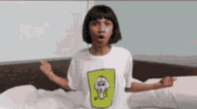 a girl wearing a white t-shirt with a skull on it