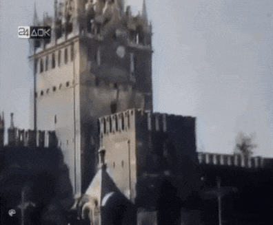 a black and white photo of a castle with the words 24 ack on the bottom right corner