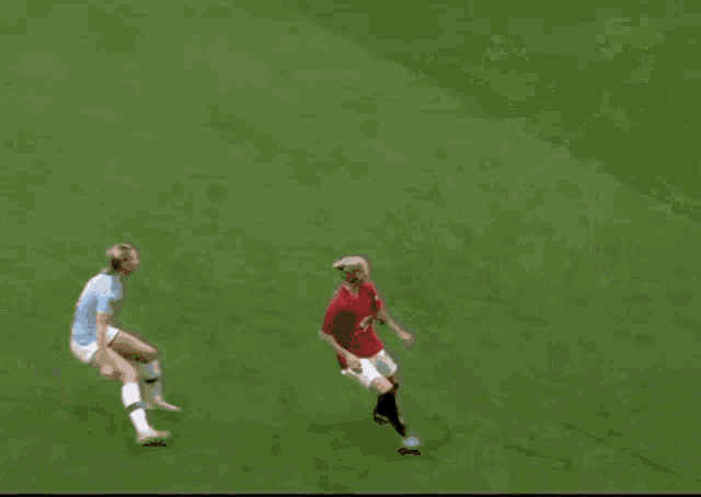 a group of women playing soccer on a field