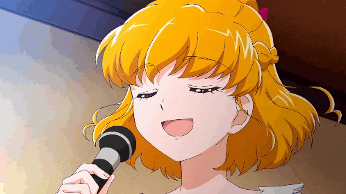 a girl with blonde hair singing into a microphone