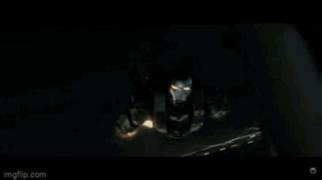 a man in a suit is flying through the air while holding a sword .