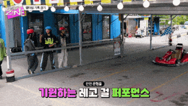a group of people are standing in front of a building with a sign that says ' zine ' on it