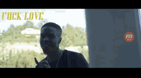 a man giving a thumbs up with the words " fuck love " written above him