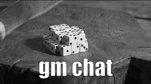 a black and white photo of dice stacked on top of each other on a rock with the words `` gm chat '' .